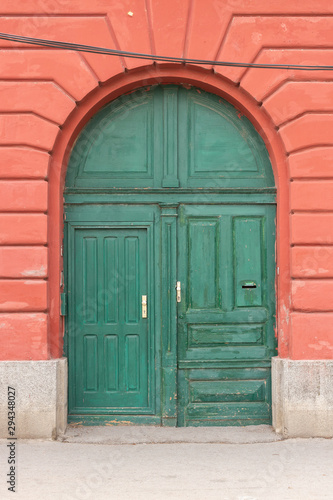 Old green wooden door with new locks and door handles. Elements © ok_fotoday
