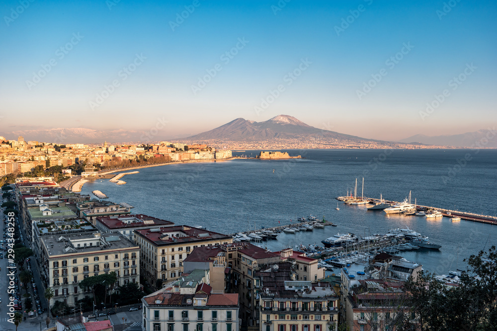 Panoramic view of the famous gulf of Naples, with the Vesuvius on Background at sunset, Naples, Campania, Italy