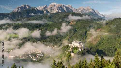 Hohenwerfen Castle in Austria. Foggy morning in Autumn Season. 4k Time Lapse. 
