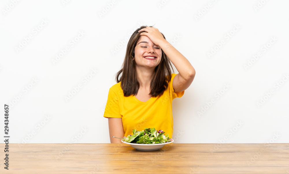 Caucasian girl with salad laughing Caucasian girl with salad laughing