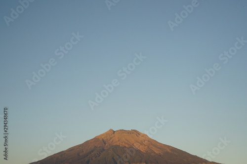 Great peak Sumbing mountain at Indonesia with yellow color because showering morning sun light