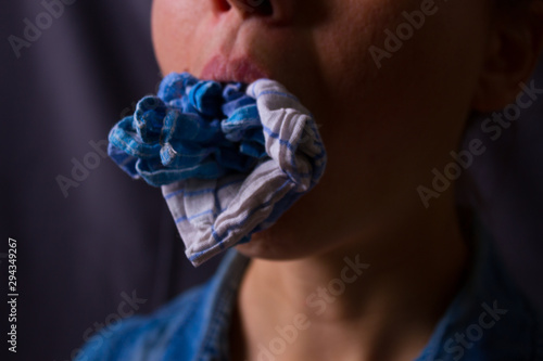 Tableau sur toile Unrecognizable woman with gag