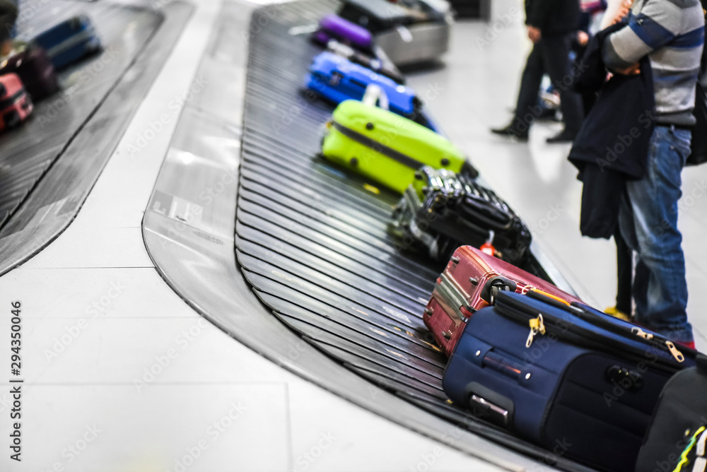 Fototapeta premium Suit case conveyor belt at airport baggage to claim.