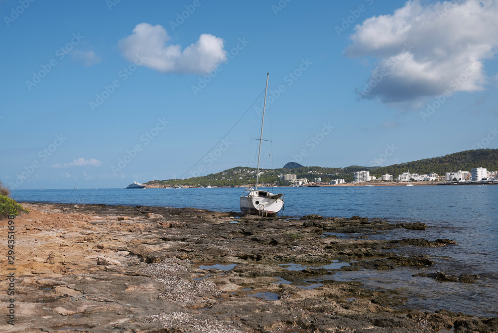 Ibiza, Spain - September 03, 2019 : Abandoned boat near Cala Pinet Ibiza, Spain - September 03, 2019 : Abandoned boat near Cala Pinet
