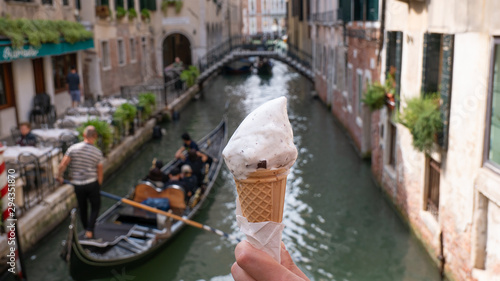 an ice cream in the background gondola in venice