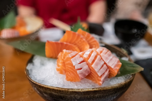 Close up of Salmon sashimi on the bowl.