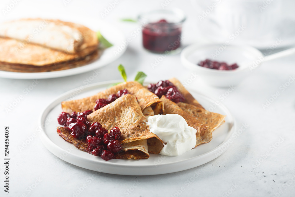 Homemade crepes with cherry sauce Homemade crepes with cherry sauce