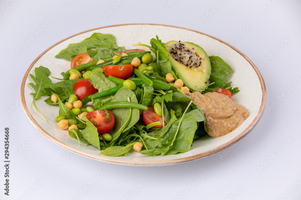 Healthy natural food. Salad with green vegetables, vitamins on the plate.