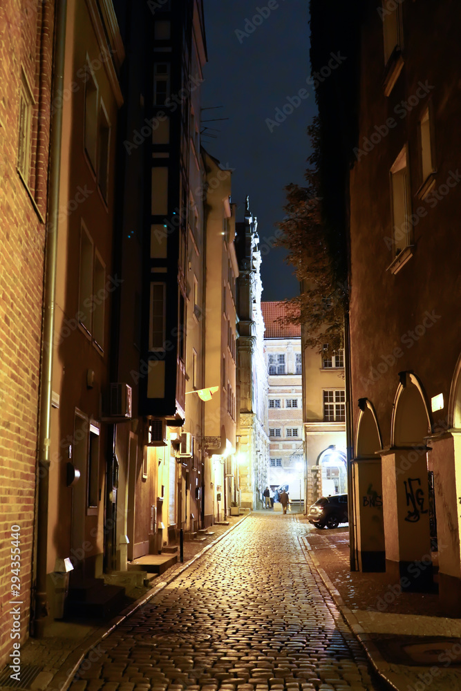 Gdansk, Poland - September 2019: View of the night streets of the city. The architecture of the old city in the night.