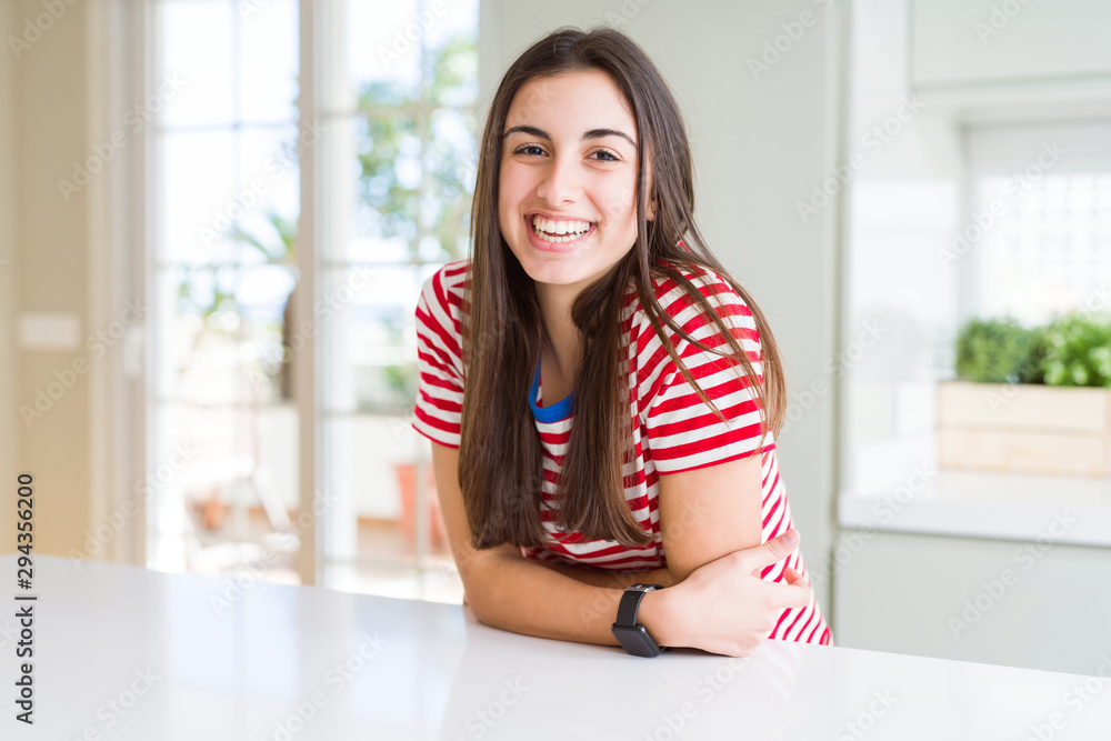 Beautiful young brunette woman smiling cheerful looking at the camera with a big smile on face showing teeth