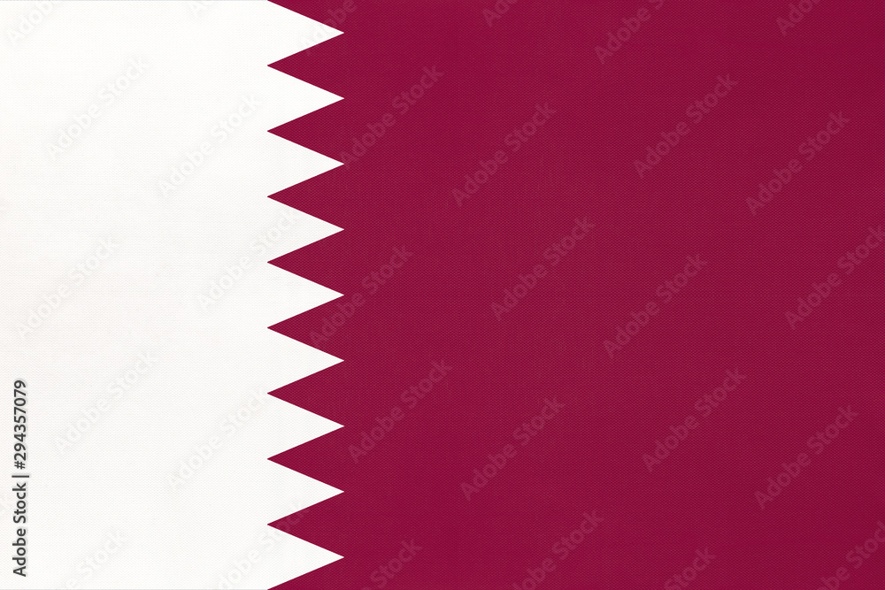 Qatar national fabric flag textile background. Symbol of world asian country.