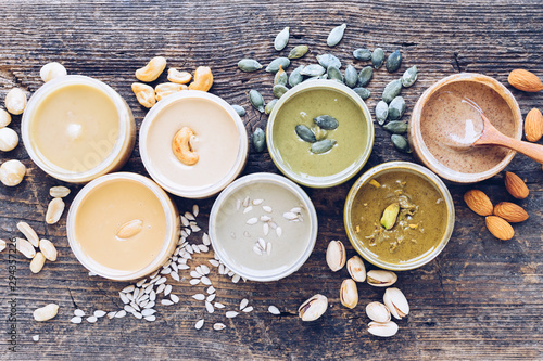 Tableau sur toile Nuts and seeds butter in glass jars