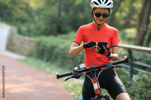 Photography Riding on bike path,using smartphone while riding bike on sunny day