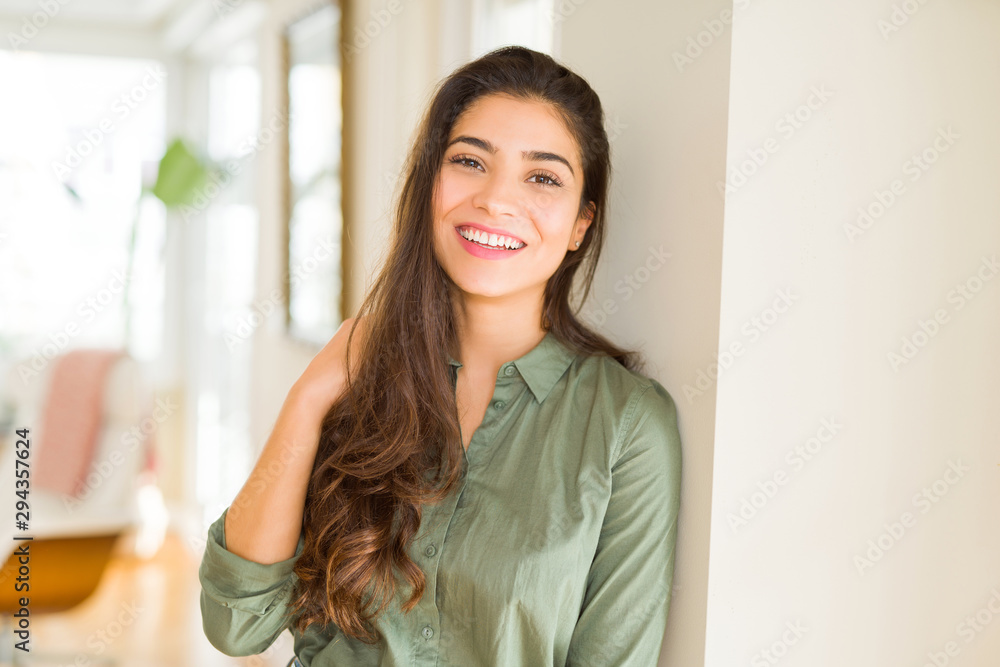 Beautiful brunette woman smiling cheerful, looking happy and positive Beautiful brunette woman smiling cheerful, looking happy and positive
