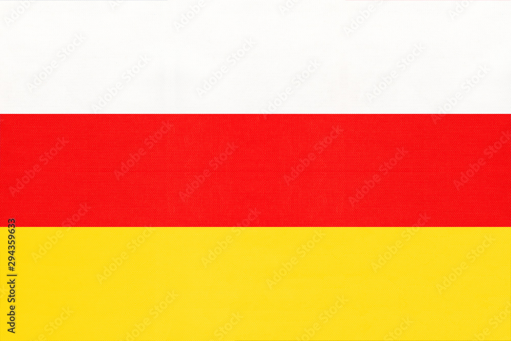 South Ossetia national fabric flag textile background. Symbol of world asian country.