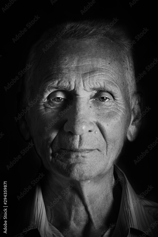 portrait of an elderly man in black and white, close-up