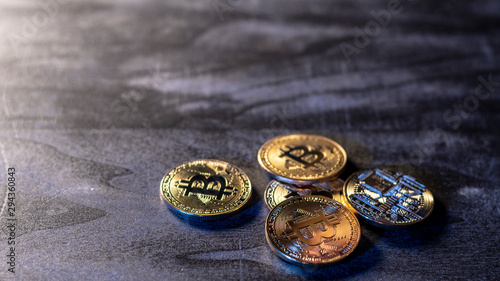 bitcoin coins on a wooden surface