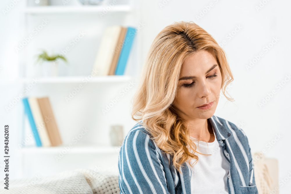 frustrated woman with bad mood in living room frustrated woman with bad mood in living room