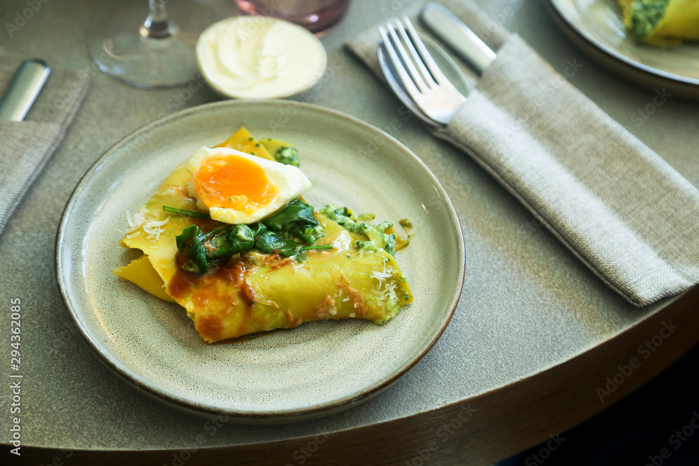 Homemade pasta with poached egg and spinach Homemade pasta with poached egg and spinach