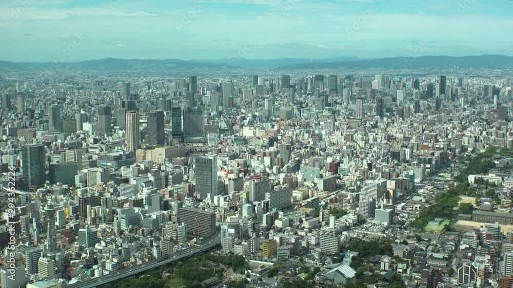 OSAKA, JAPAN - CIRCA SEPTEMBER 2019 : Aerial high angle view of CITYSCAPE of OSAKA in daytime. View of buildings around Namba, Shinsaibashi, Umeda and Osaka station. OSAKA, JAPAN - CIRCA SEPTEMBER 2019 : Aerial high angle view of CITYSCAPE of OSAKA in daytime. View of buildings around Namba, Shinsaibashi, Umeda and Osaka station.
