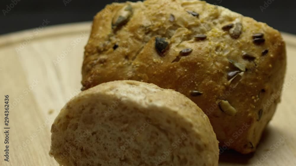 Two pieces of integral bread on a wooden board