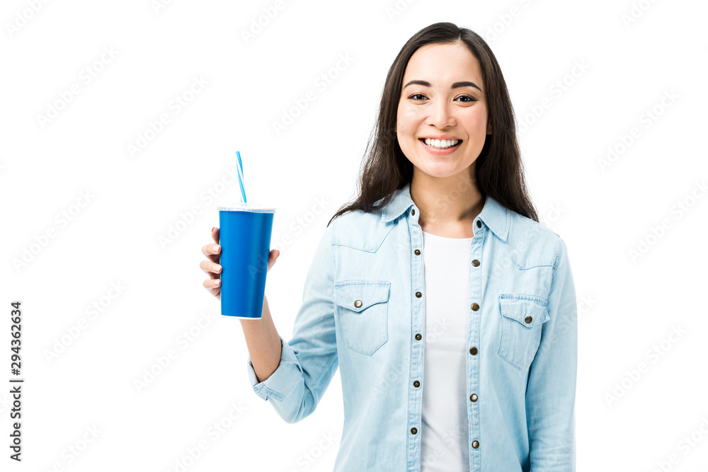 attractive and smiling asian woman in denim shirt holding plastic cup isolated on white attractive and smiling asian woman in denim shirt holding plastic cup isolated on white