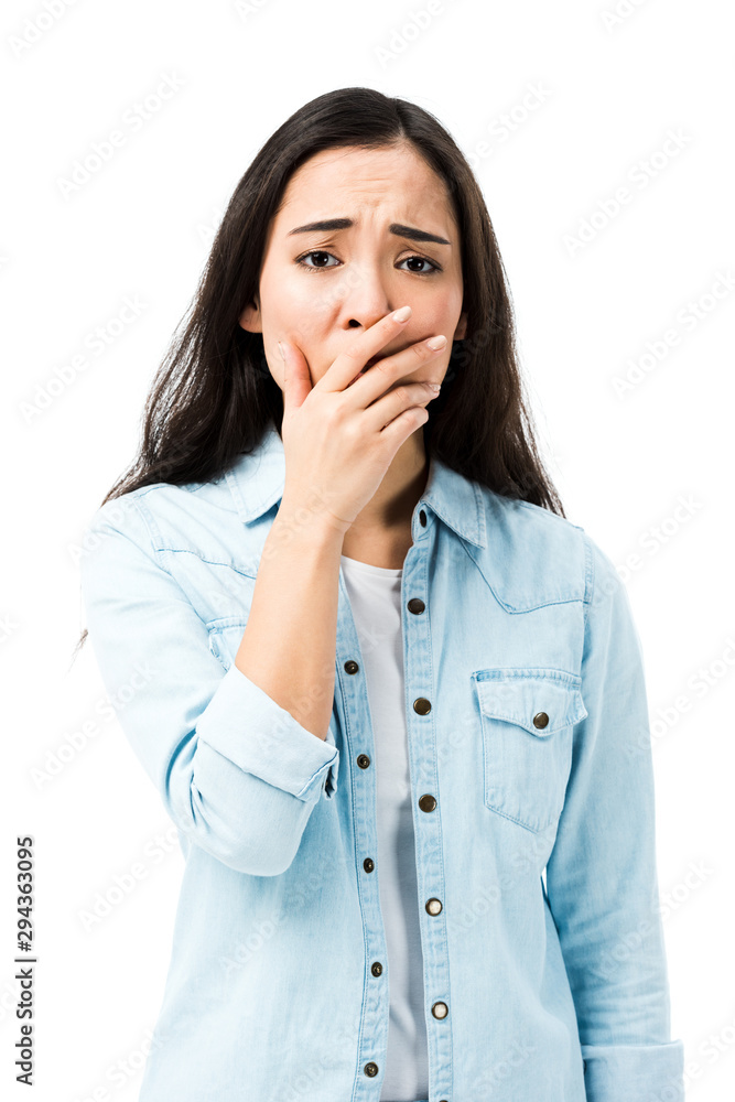 attractive and shocked asian woman in denim shirt looking at camera isolated on white attractive and shocked asian woman in denim shirt looking at camera isolated on white