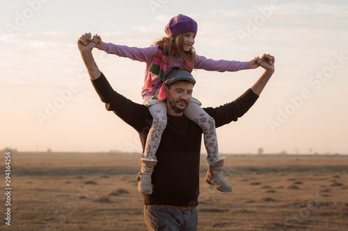 Family concept. Father and child daughter outdoors spending time together.