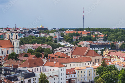Breathtaking panorama of Vilnius TV Tower and beautiful architecture of buildings in Vilnius Old Town with from Bell Tower of St. John's Church. Aerial view on the capital of Lithuania.
