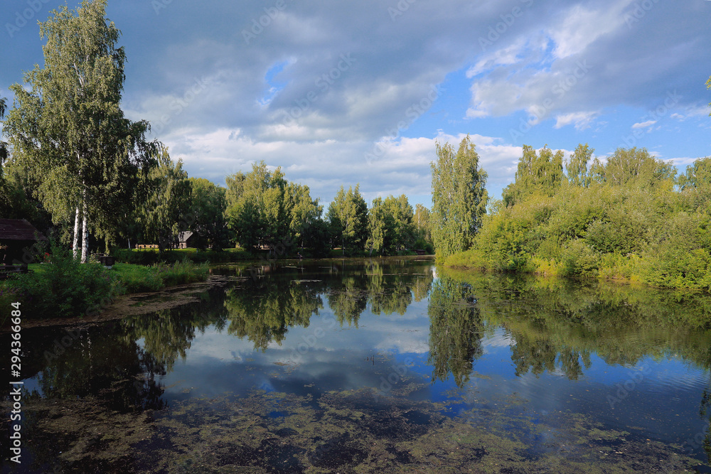 Picturesque lake, forest, sky, clouds Picturesque lake, forest, sky, clouds