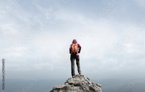 A woman traveler standing on cliff  Phu Kradueng  Thailand