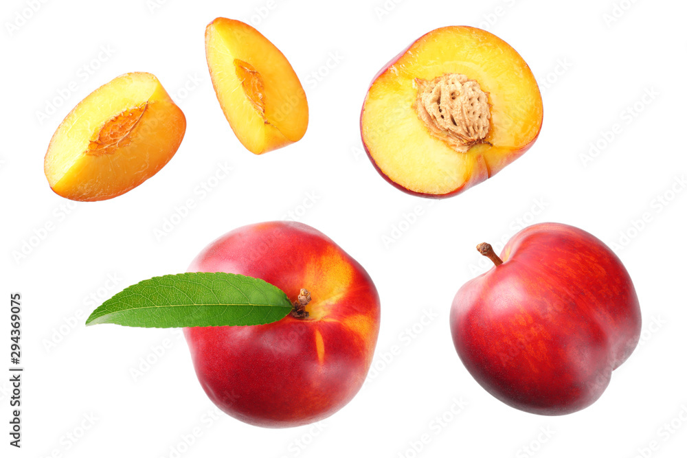 Nectarine with green leaf and slices isolated on white background. top view Nectarine with green leaf and slices isolated on white background. top view