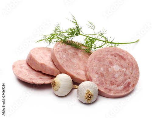 Traditional sausage salami slices with garlic cloves and fresh dill isolated on white background