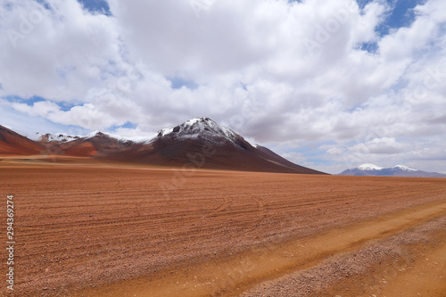 Landscape of the Bolivian highlands. Desert landscape of the Andean plateau of Bolivia with the peaks of the snow-capped volcanoes of the Andes