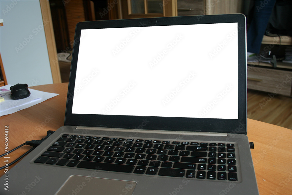 Modern computer,laptop with blank screen on wood table Modern computer,laptop with blank screen on wood table