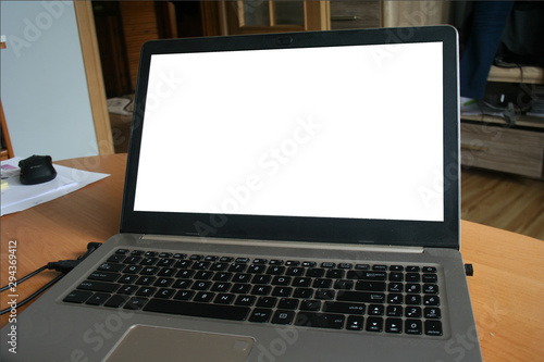 Modern computer,laptop with blank screen on wood table