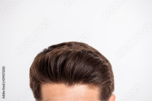 Cropped photo of charming virile guy having fresh hair after salon isolated over white background