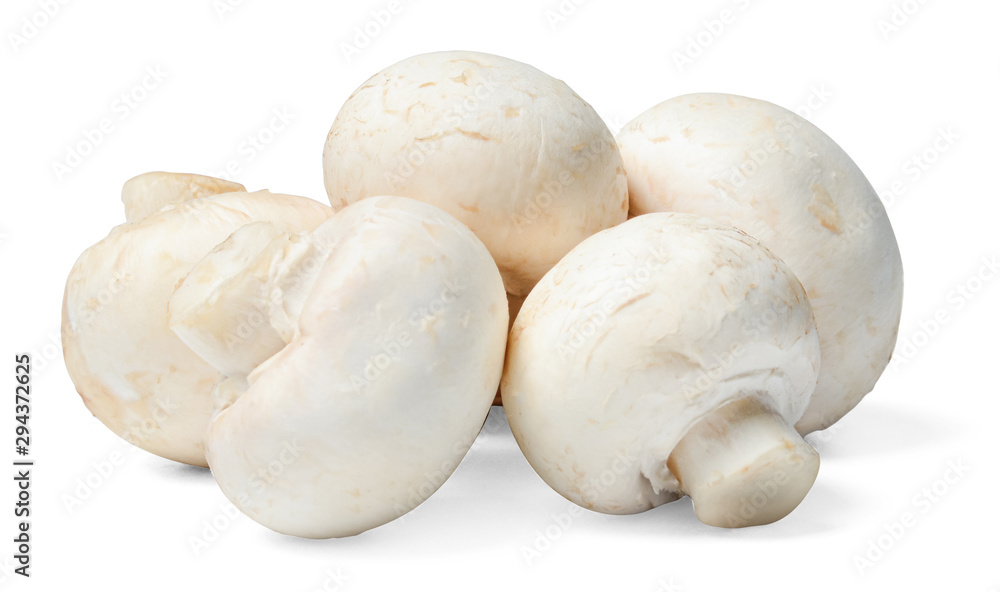 A small bunch of fresh champignons on a white isolated background. Side view. Clipping path. A small bunch of fresh champignons on a white isolated background. Side view. Clipping path.