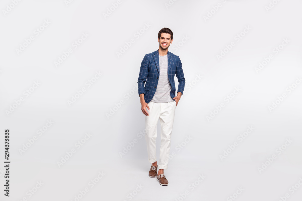 Full size photo of charming man walk go move wear modern look olaid blazer jacket pants trousers isolated over white background Full size photo of charming man walk go move wear modern look olaid blazer jacket pants trousers isolated over white background