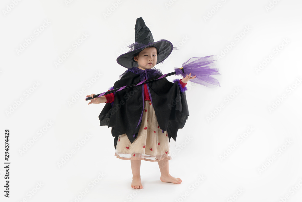 Halloween cute girl wearing witch costume in white background Halloween cute girl wearing witch costume in white background