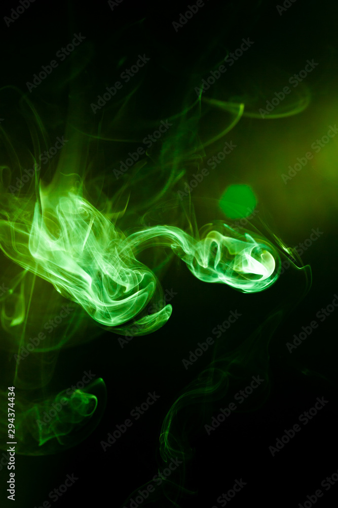 Fototapeta premium Green smoke motion on black background.