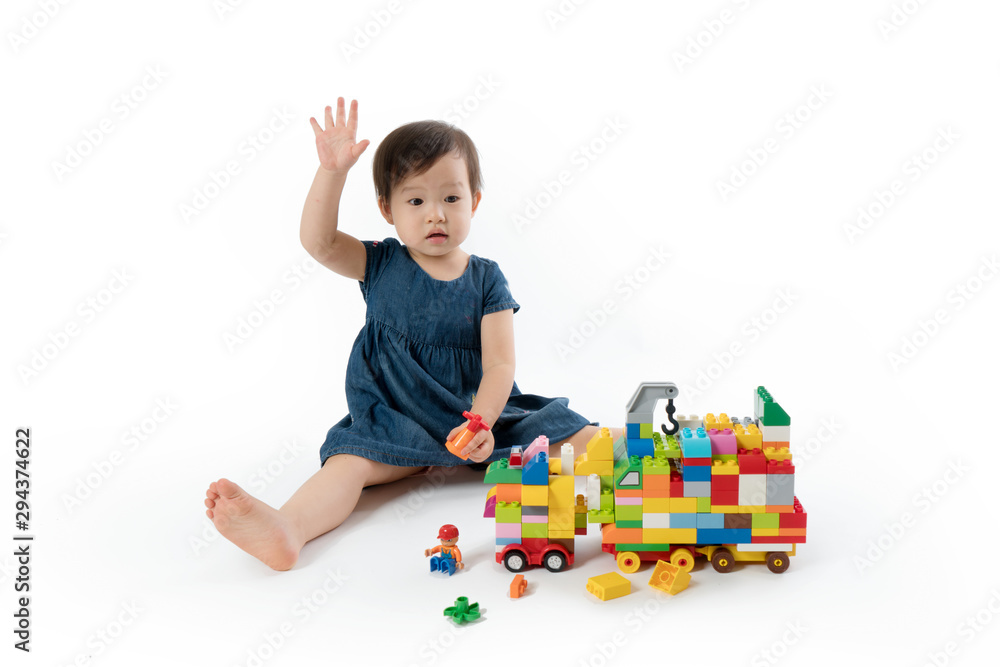 Smart Girls Combine Colored Building Blocks into a Truck Smart Girls Combine Colored Building Blocks into a Truck