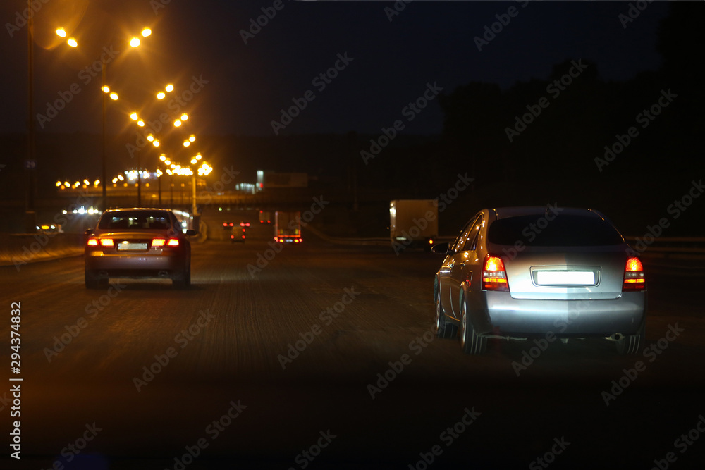 Highway with lights and cars at night. Moscow, Russia. Soft focus.