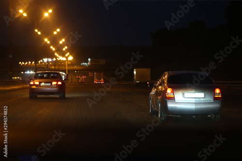 Highway with lights and cars at night. Moscow, Russia. Soft focus.