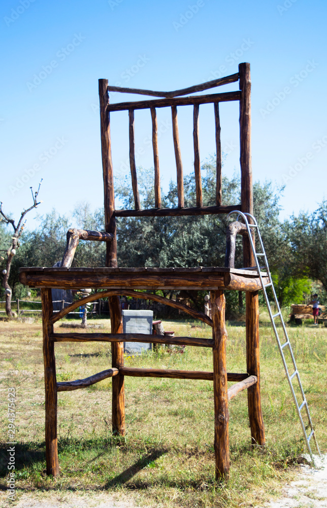 Installation of big wooden chair Installation of big wooden chair