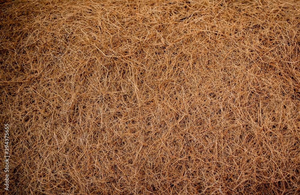 Close-up of the structure of Coco coir, a fabric made of coconut fiber, natural background. Concept of environmental consumption and production Close-up of the structure of Coco coir, a fabric made of coconut fiber, natural background. Concept of environmental consumption and production