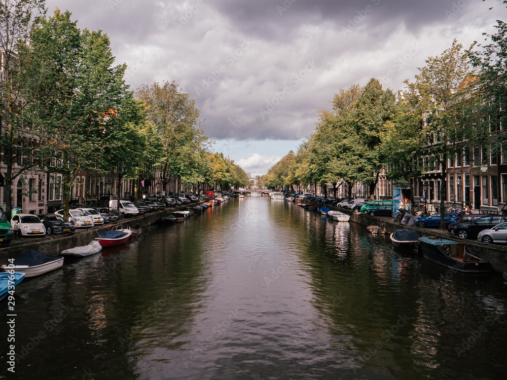  A canal between typical Dutch houses in Amsterdam.