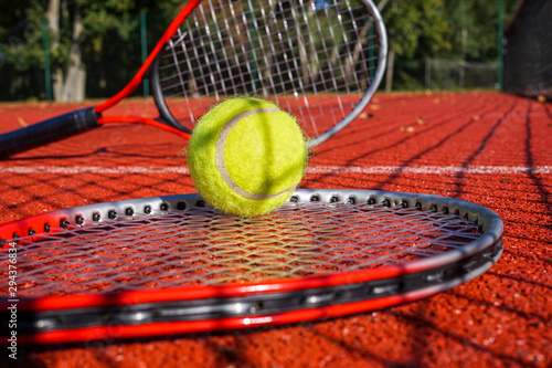 Tennis scene with net shadow, ball and racquet © NetPix