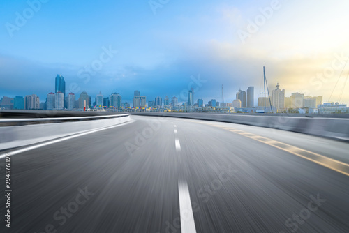 empty highway with cityscape and skyline of qingdao,China. © onlyyouqj