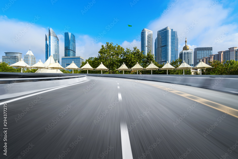 empty highway with cityscape and skyline of qingdao,China.